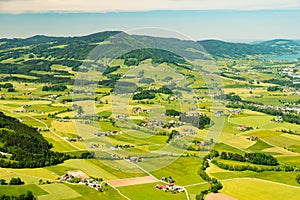 Aerial view on colorful small field parcels near Mondsee, Austria