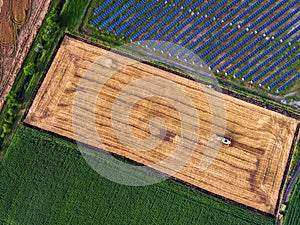 Aerial view of combine on harvest field