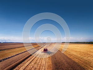 Aerial view of Combine harvester agriculture machine harvesting