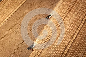 Aerial view combine harvester harvesting on the field