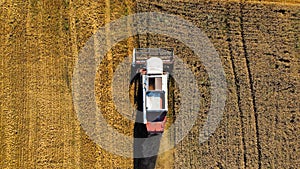 Aerial view of combine harvesting crops.