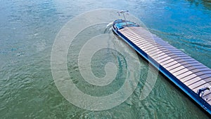 Aerial view commercial ship crossing the River Rhine, Germany