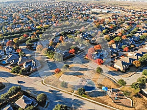 Aerial view community playground near urban sprawl with colorful