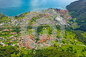 Aerial view of Como lake, Dongo, Italy. Coastline is washed by blue turquoise water.