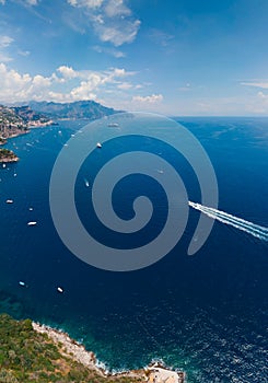 Aerial view of Conca dei Marini. Beautiful bay and famous resort near Amalfi, vertical photo, copy space. Italy, Europe