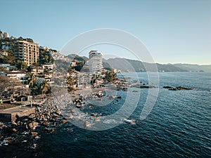 Aerial view of Conchas Chinas Beach and hotels in Puerto Vallarta Mexico in late afternoon photo