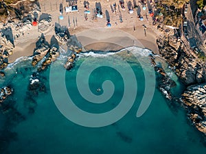 Aerial view of Conchas Chinas Beach in Puerto Vallarta Mexico showing clear turquoise water in ocean photo