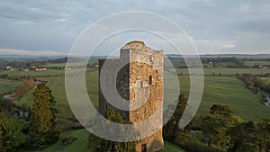 Aerial view of Conna Castle in county Cork, Ireland, a ruined five storey square tower house about 85 feet tall built in 1550