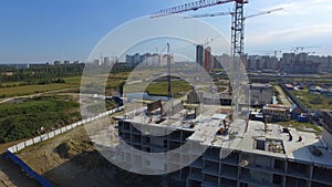 Aerial view on construction building. Construction site workers, aerial, Top View. Overhead view of construction site