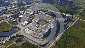 Aerial view on construction building. Construction site workers, aerial, Top View. Overhead view of construction site