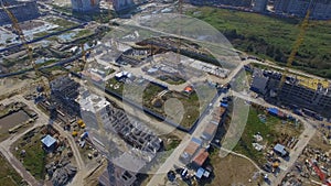 Aerial view on construction building. Construction site workers, aerial, Top View. Overhead view of construction site