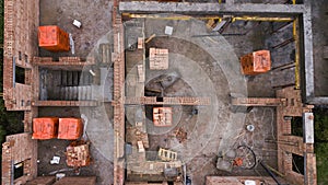 Aerial view of construction site new family houses. Construction industry in the city from above