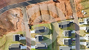 Aerial view of construction site with new tightly packed homes in South Carolina. Family houses as example of real