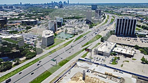 Aerial view construction site wooden framing next to Stemmons Freeway Interstate Highway I-35E, business park in Northwest Dallas