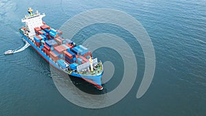 Aerial view container cargo ship, business freight shipping international by container cargo ship in the open sea.