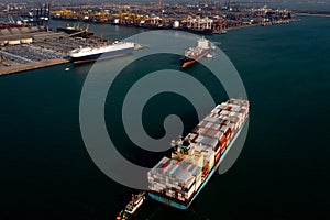 Aerial view container cargo ship carrying commercial container in import export business commerce logistic and transportation of