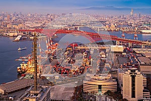 Aerial view of container cargo ship in the export and import business and logistics international goods in urban city. Shipping to