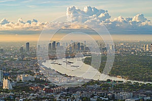 Aerial view of container cargo ship in the export and import business and logistics international goods in urban city. Shipping to