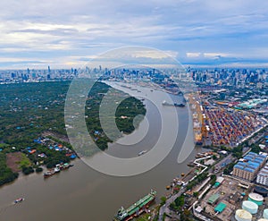 Aerial view of container cargo ship in the export, import business, logistics and transportation. International goods in urban