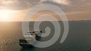 Aerial view of a container cargo ship on the sea. Cargo and shipping logistics business. Export and import container ship.