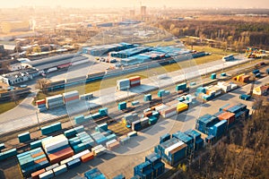 Aerial view of container loading and unloading at sunset