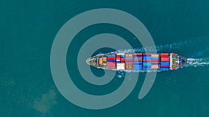 Aerial view container ship carrying container for import and export, business logistic and freight transportation by ship in open