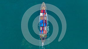 Aerial view container ship carrying container for import and export, business logistic and freight transportation by ship in open