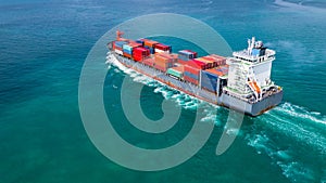 Aerial view container ship carrying container for import and export, business logistic and freight transportation by ship in open
