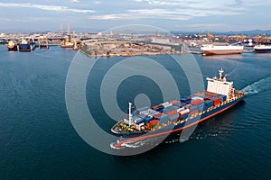 Aerial view container ship carrying container in import export business logistic and transportation