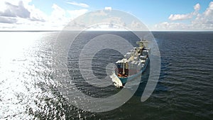 Aerial view of container ship sailing in the sea