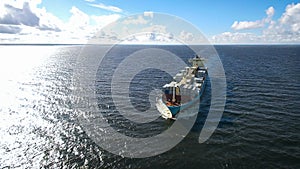 Aerial view of container ship sailing in the sea