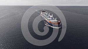 Aerial view of container ship sailing in the sea