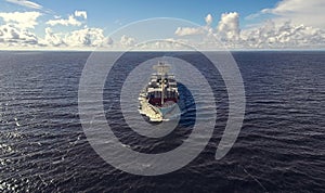 Aerial view of container ship sailing in the sea