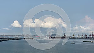 Aerial view of a container terminal in the import-export business industry in Sriracha Industrial Port, Chonburi, Thailand.