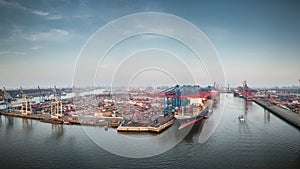 Aerial view of a container terminal in the port of hamburg at sunset