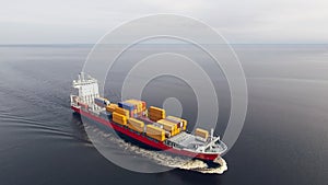 Aerial view of container vessel sailing in the sea