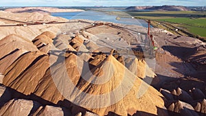 Aerial view of a conveyor in salt pits, mining of potash and salt, conveyor line in working process, salt quarries