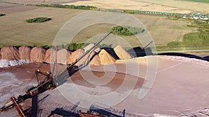 Aerial view of a conveyor in salt pits, mining of potash and salt, conveyor line in working process, salt quarries