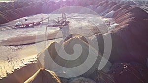 Aerial view of a conveyor in salt pits, mining of potash and salt, conveyor line in working process, salt quarries