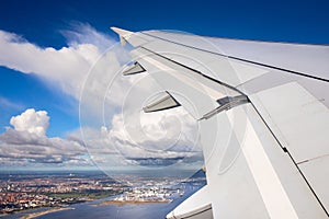 Aerial view of Copenhagen city with petrochemical and power plant industry from window airplane view with clear blue sky and rainy