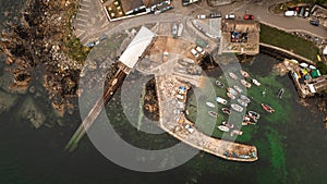 Aerial view of the Cornish fishing village of Coverack and its traditional harbour