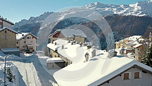 Aerial view of cottages and chalets in ski resort in the ski area of Madesimo and Valchiavenna, alpine valleys, northern
