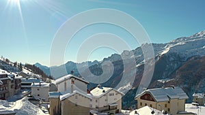 Aerial view of cottages and chalets in ski resort in the ski area of Madesimo and Valchiavenna, alpine valleys, northern