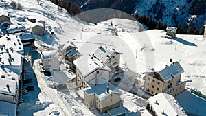 Aerial view of cottages and chalets in ski resort in the ski area of Madesimo and Valchiavenna, alpine valleys, northern