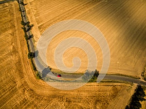 Aerial view of a country road amid fields