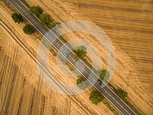 Aerial view of a country road amid fields
