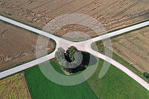 Aerial view of a country road crossroads in summer