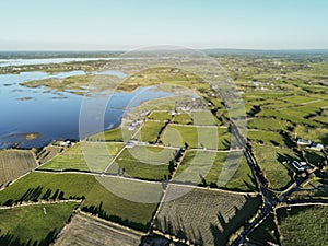 Aerial view of country side in Ireland, by a lake.