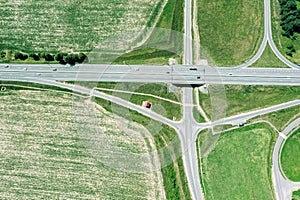 Aerial view of countryside with cultivated fields and road intersection