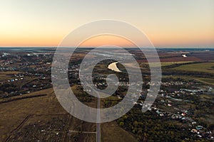 Aerial view of countryside village panorama in autumn sunset